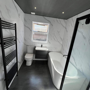 white bathroom white black sink and radiator