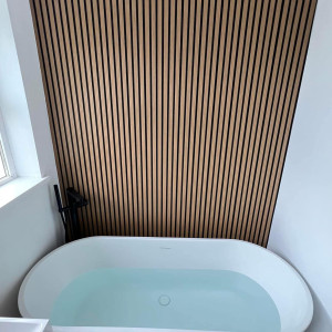 bath beside acoustic wood panel