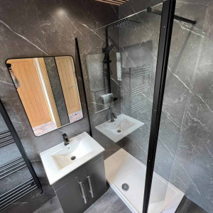 wood ceiling lighting and grey bathroom sink